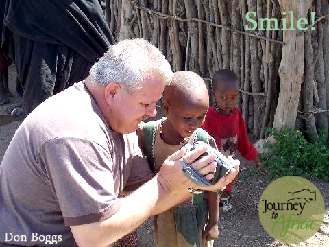 Don showing a little boy his own image. The smile on the boy is precious!